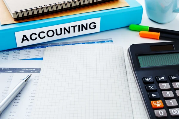 Accounting work desk with blank notebook — Stock Photo, Image