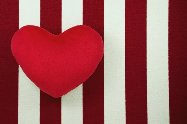 Heart on white and red striped canvas — Stock Photo, Image