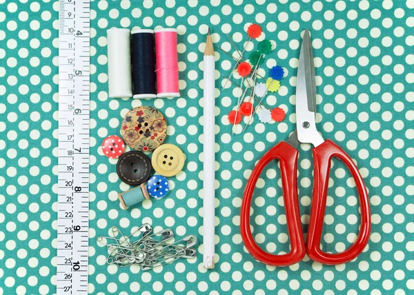 Sewing kit on polka dot fabric — Stock Photo, Image