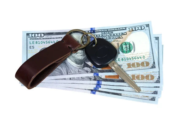 Car key on money isolated on white — Stock Photo, Image