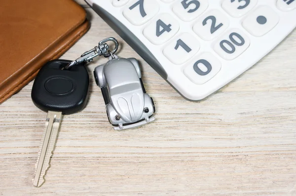 Car key with calculator and wallet — Stock Photo, Image