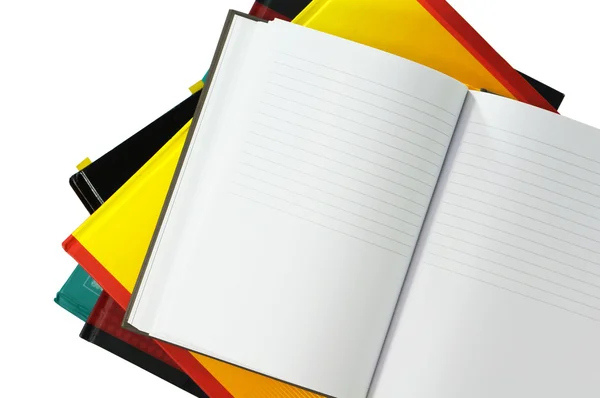 Notebook on books isolated on white — Stock Photo, Image