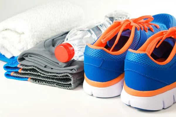 Sport shoes with clothing — Stock Photo, Image