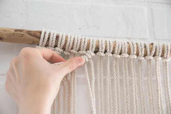 Woman Knits Weaving Macrame Pinned Wooden Stick White Brick Wall — Stock Photo, Image