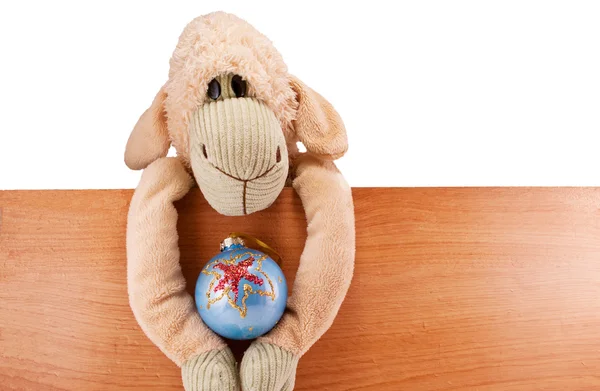 Toy sheep on the board — Stock Photo, Image