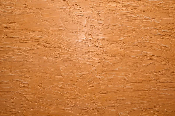 Orange wall with plaster — Stock Photo, Image
