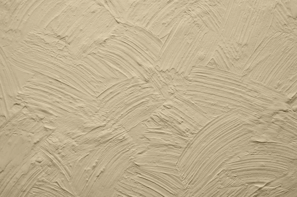 Beige wall with plaster relief — Stock Photo, Image