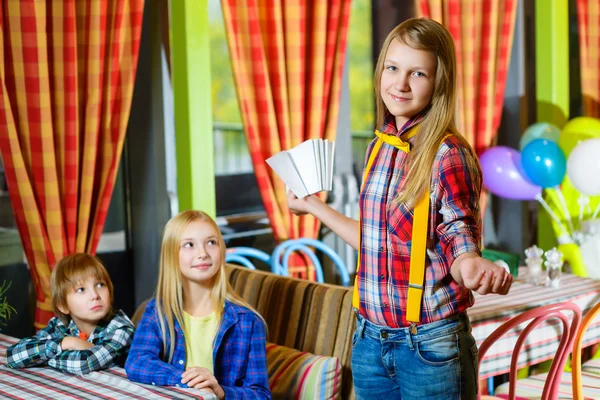 smiling confused girl waiter takes the order from visitors