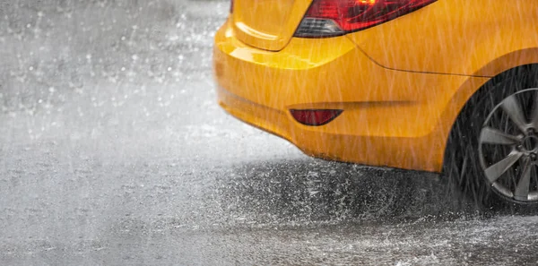 yellow car on a rainy day. Close up