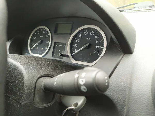 Close-up view in car dashboard with instruments of measurement in car cockpit with instrument panel for speeding and speedometer, tachometer and rpm indicators for safe mobility in motorized sport car