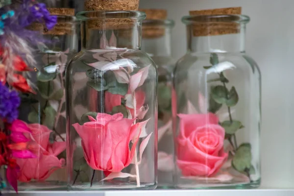 perfume bottles with flowers in store