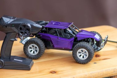 Off road rc car with remote control and battery ready to race in competition and tournaments in radio controlled challenges and outdoor parcours as fun for children and grown ups and rally hobby track
