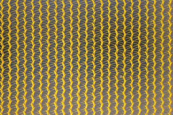 Żółta Struktura Siatki Zbliżeniu Podświetleniem Połysk Rano Pokazuje Abstrakcyjny Wzór — Zdjęcie stockowe