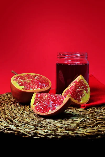 Pomegranate still life and glass jar with pomegranate juice. Super fruit with excellent properties
