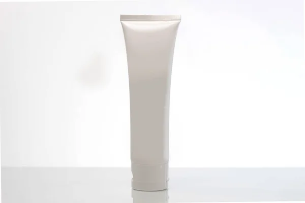 White cream tube mockup on plain white background. cosmetic health and personal care products such as creams, gels, ointments. Laboratory containers