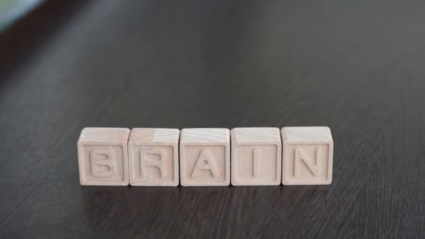 Female hands change first letter in word brain so that it turns to train — Video Stock