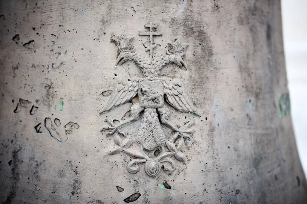 An old image of the Russian coat of arms - a two-headed eagle - on a bell in the Ipatiev Monastery in Kostroma