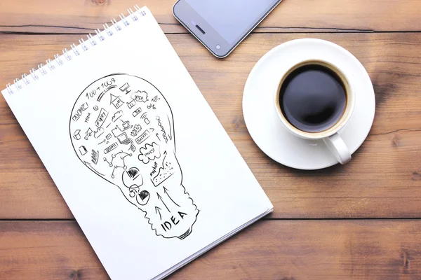 Notebook, penna, telefon och kaffe på bordet — Stockfoto