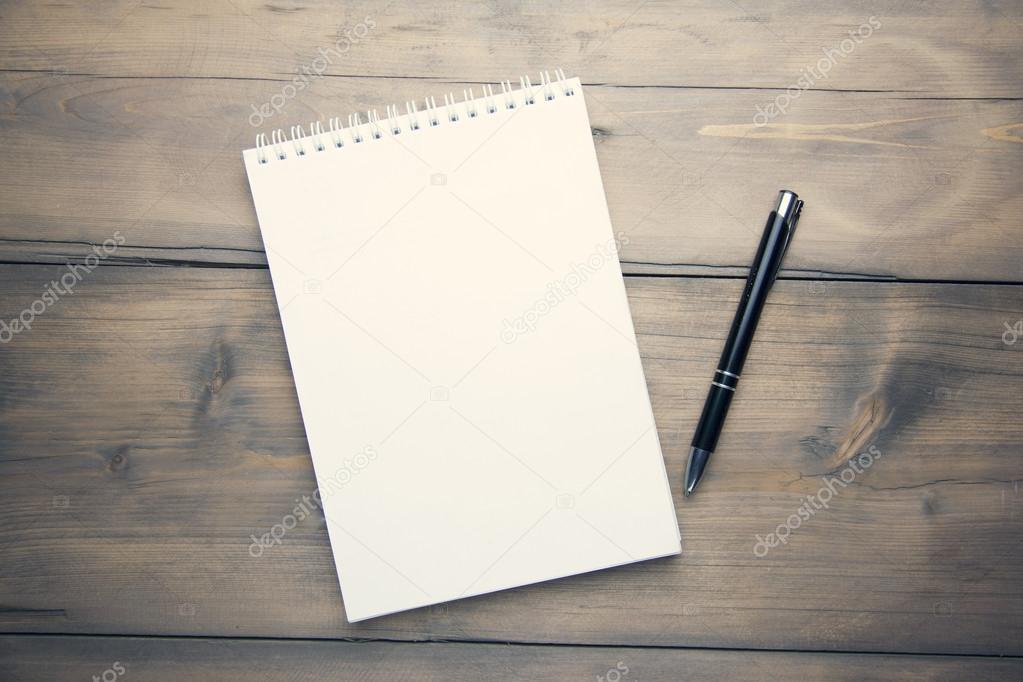 notebook and pen on table