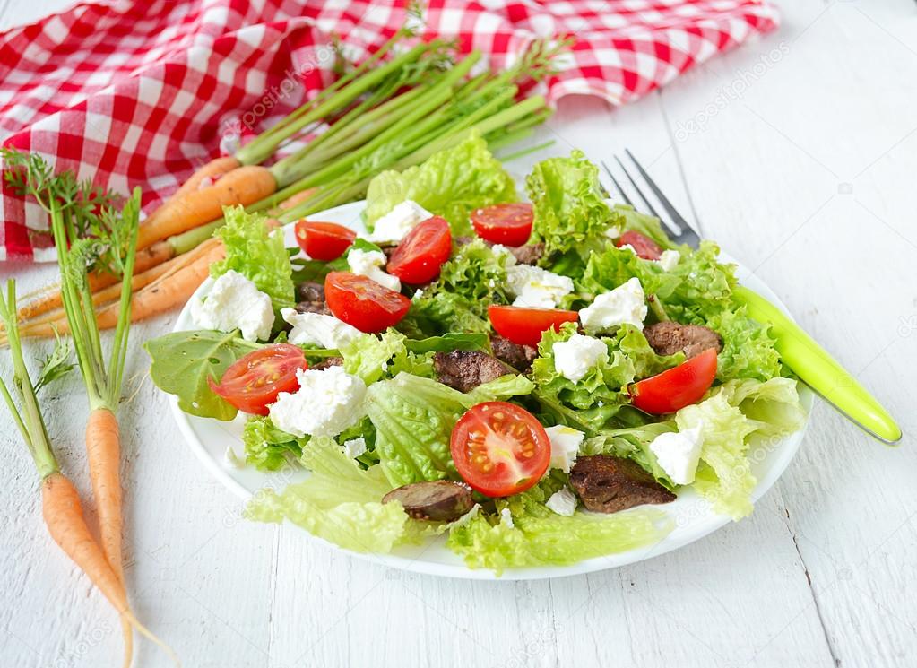 salad with chicken liver. cherry tomatoes and feta cheese