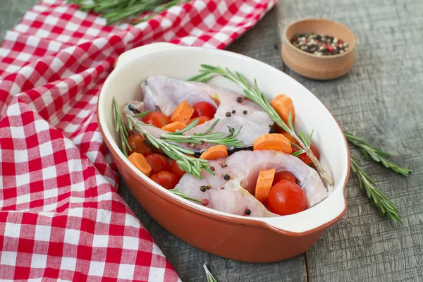 Carp steak with rosemary and pepper in a ceramic form — Stock Photo, Image