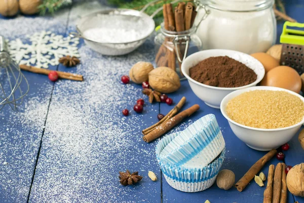 Ingredients for baking Christmas muffins on wooden background. s — Stock Photo, Image