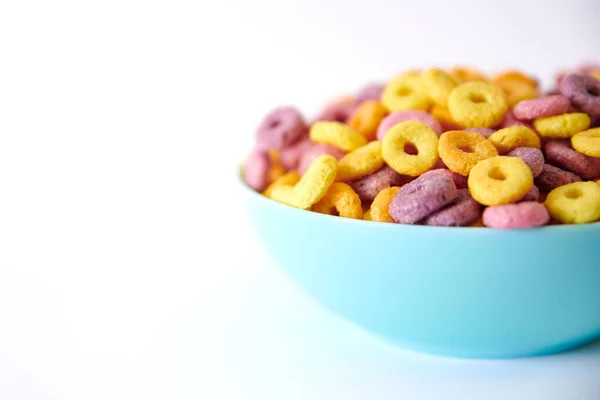 Closeup Shot Multicolored Fruity Cereals Blue Bowl Isolated White Background — Stock Photo, Image