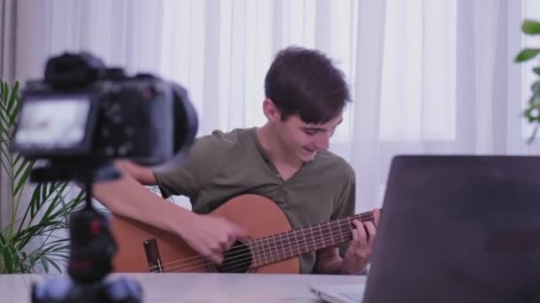 Man Blogger Videotapes His Vlog Home While Playing Guitar Teen — Stock Video