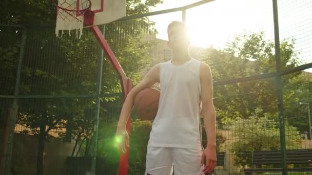 Video Boy Standing Basketball Court Holding Basketball Cinematic Shot Teenager — Stock Video