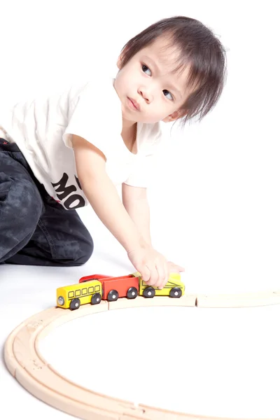 Boy building with colorful wooden blocks — Stock Photo, Image