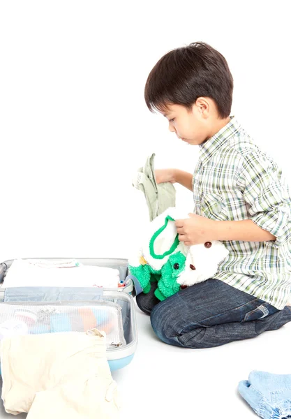 Boy with a suitcase is standing — Stock Photo, Image