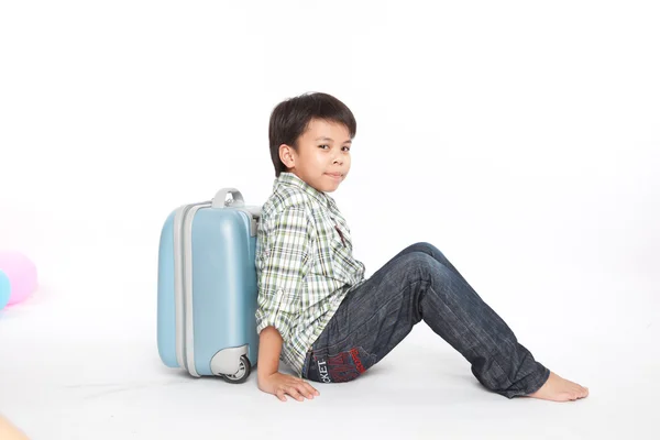 Boy with a suitcase is standing — Stock Photo, Image