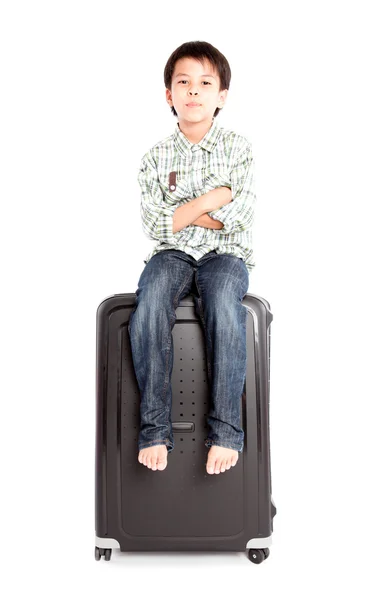 Boy with a suitcase is standing — Stock Photo, Image