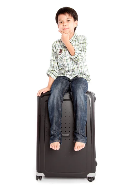 Boy with a suitcase is standing — Stock Photo, Image