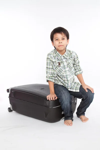 Boy with a suitcase is standing — Stock Photo, Image