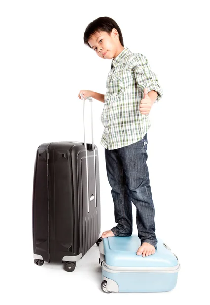 Boy with a suitcase is standing — Stock Photo, Image