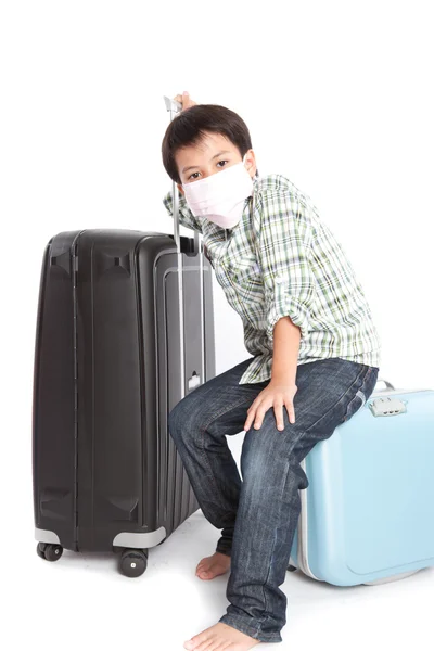 Boy with a suitcase is standing — Stock Photo, Image