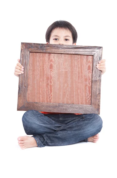 Мальчик держит рамку — стоковое фото