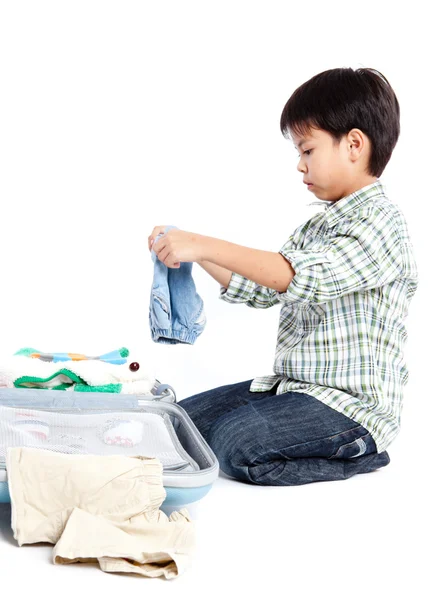 Boy with a suitcase is standing Royalty Free Stock Photos