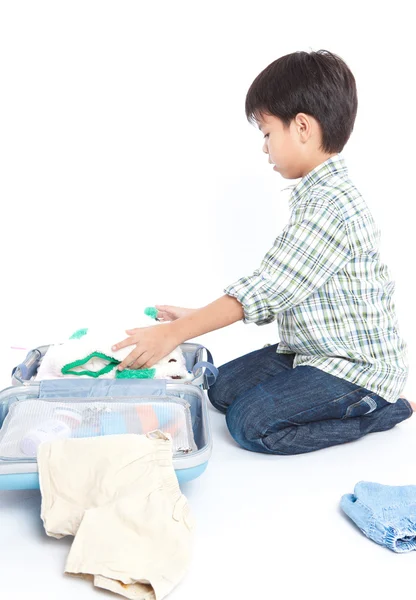 Boy with a suitcase is standing Stock Image