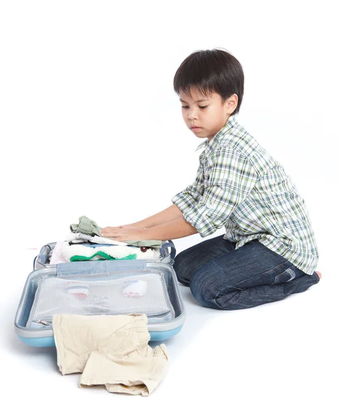 Boy with a suitcase is standing Royalty Free Stock Images