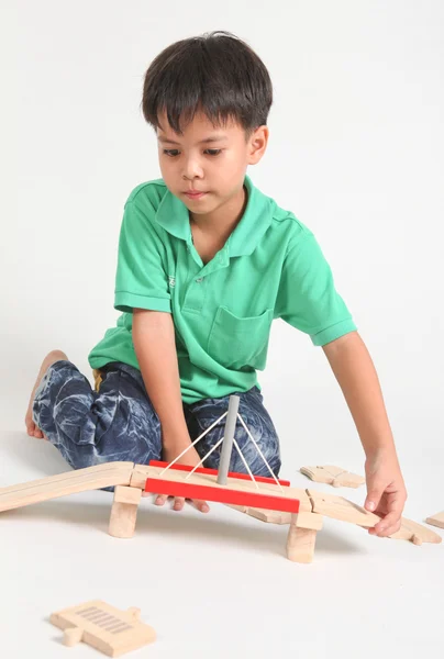 Boy building  with colorful wooden blocks — Stock Photo, Image