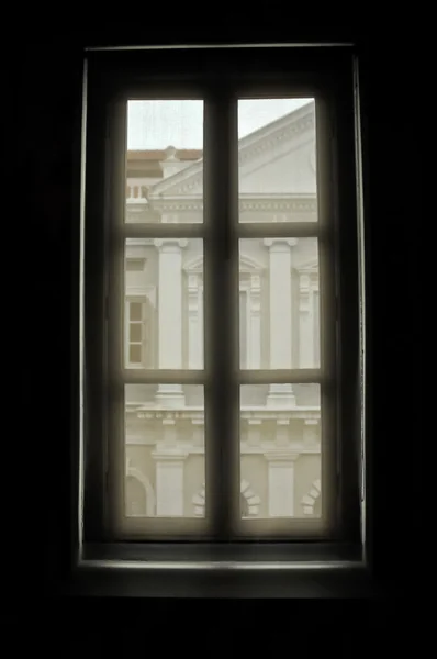 Looking through a window to see European building — Stock Photo, Image