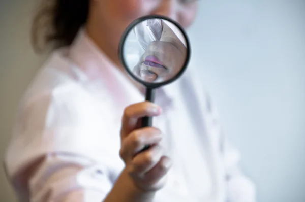 Business woman hold magnifier — Stock Photo, Image