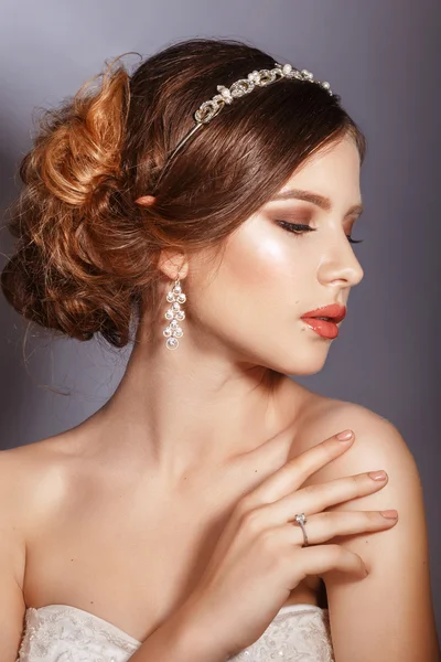 Beautiful bride with fashion wedding hairstyle .Closeup portrait of young gorgeous bride. Wedding. Studio shot Royalty Free Stock Images