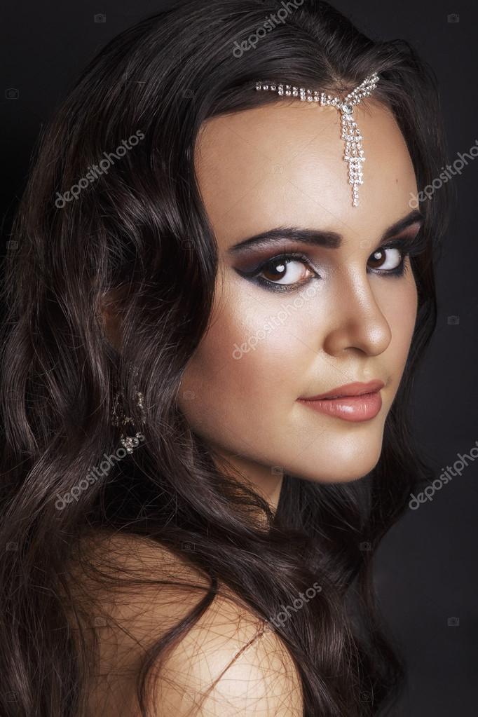 Oriental style. Sensual arabic woman model. Beautiful clean skin, saturated  makeup. Bright eye make-up and dark eyeliner.Arab woman. Beautiful creative  makeup. Stock Photo by ©helenaak14 107919224