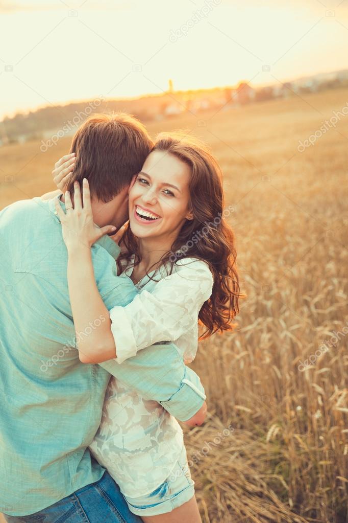 Young couple in love outdoor.Stunning sensual outdoor portrait of young stylish fashion couple posing in summer in  field