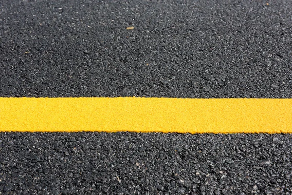 Yellow line on the new road — Stock Photo, Image