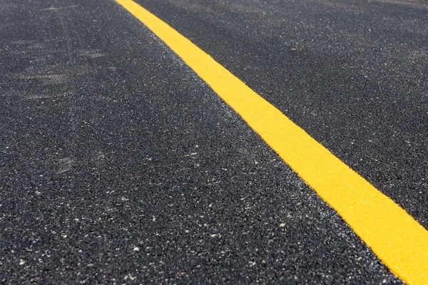 Yellow line on the new road — Stock Photo, Image