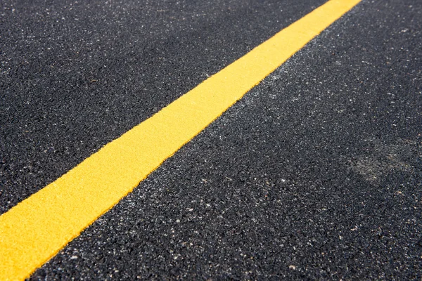 Yellow line on the new road — Stock Photo, Image